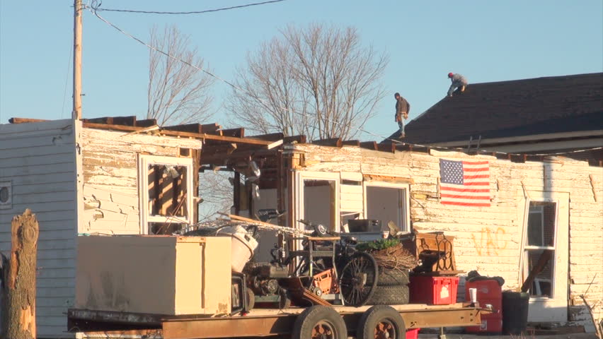 HENRYVILLE, IN - USA, MARCH 10, 2012- An American flag flies over the rubble in Henryville, IN, nearly a week after an EF-4 tornado struck the community on March 2, 2012. 