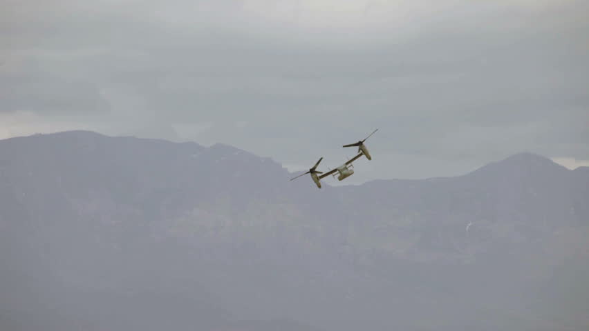 Aircraft V-22 Osprey VTOL hover slow flight mode doing vertical takeoff and landing video. Used by USAF, Marines, Navy and NATO allies in Utah