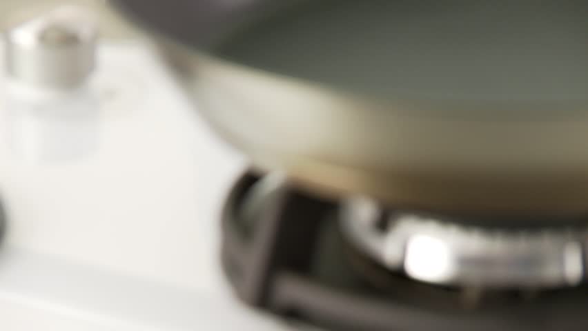 Olive oil being heated in a non-stick pan
