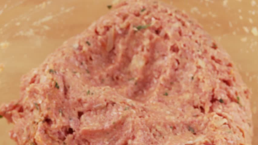 Burgers being shaped from minced meat dough
