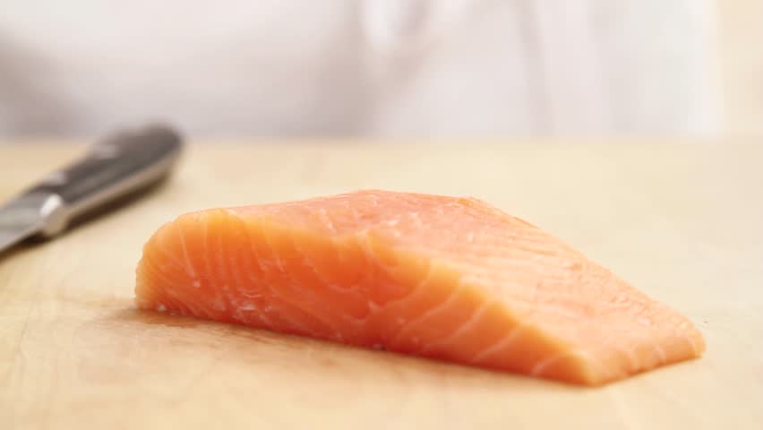 Salmon fillet being sliced