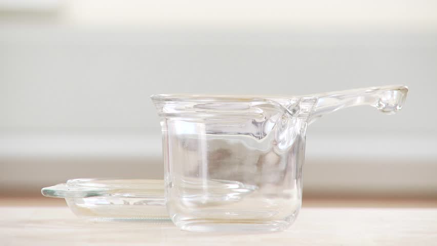 Gravy being poured into a gravy boat