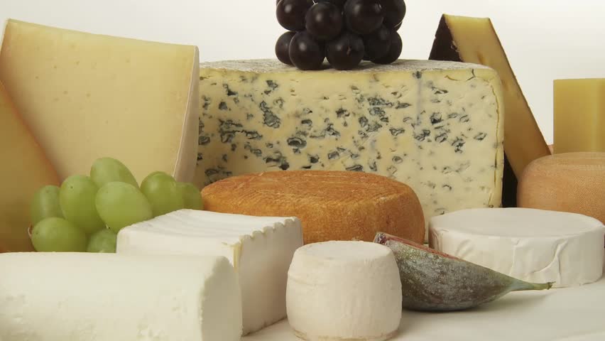 Various cheeses with figs and grapes