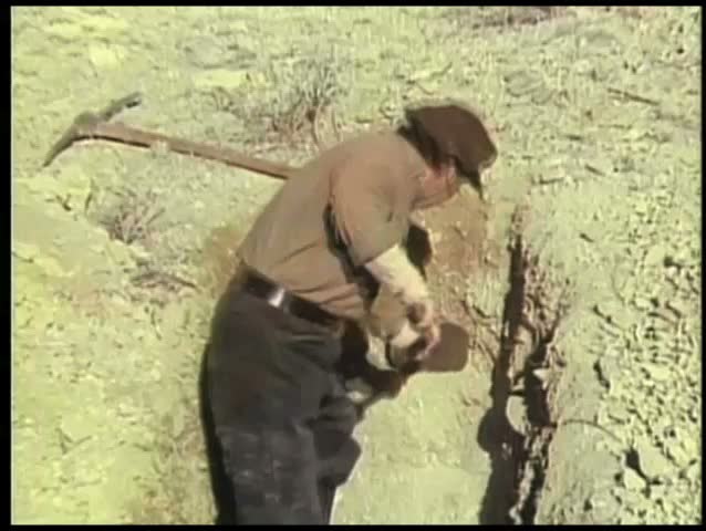 Man digging grave