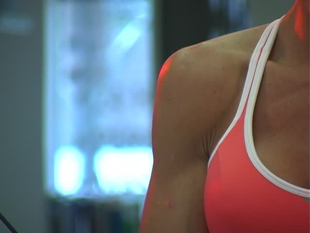A lovely young female bodysculptor at the Gym 15