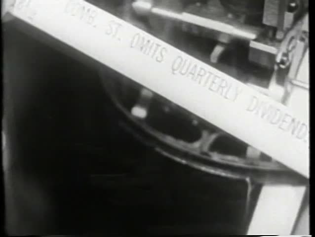 Wide shot of activity on trading floor, 1930s