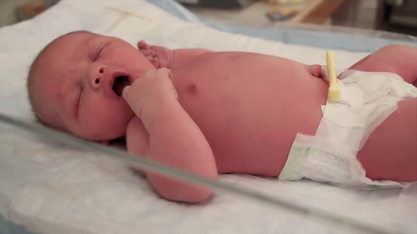 A newborn baby at the hospital born just minutes before being cleaned by the nursing staff.