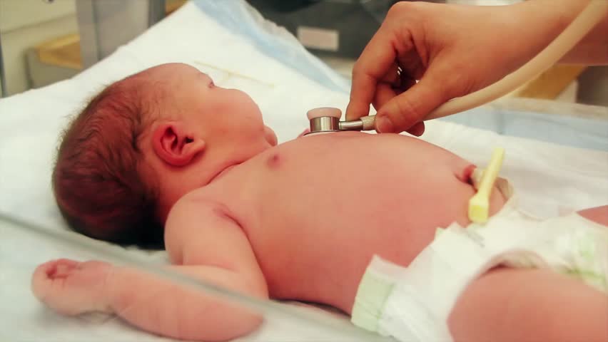 A newborn baby at the hospital born just minutes before being cleaned by the nursing staff.