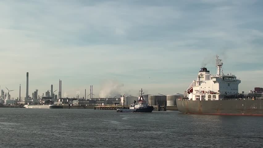 two shots of oil tanker and pilot boat in harbor of rotterdam