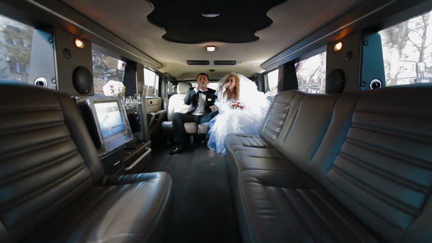 Just Married Young Couple Inside Limo, Wide shot