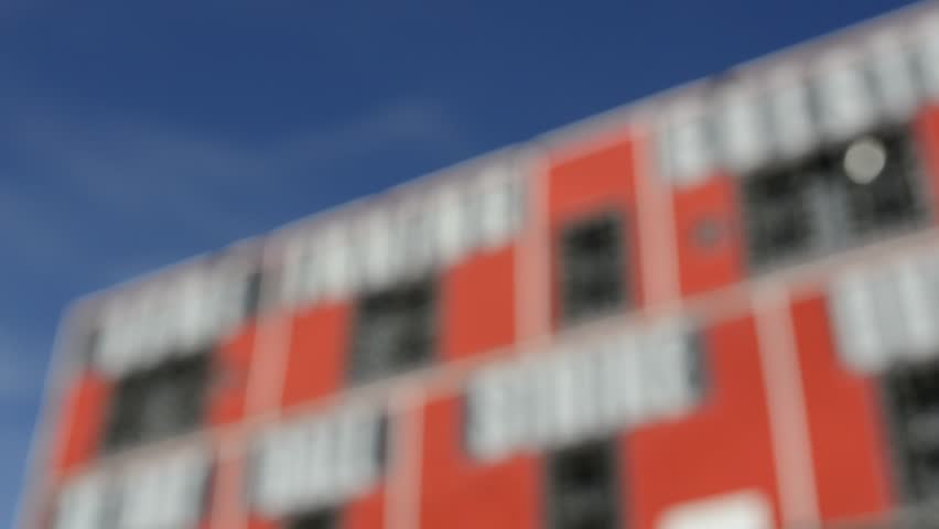 Baseball Scoreboard Coming Into Focus with Blue Sky in Background