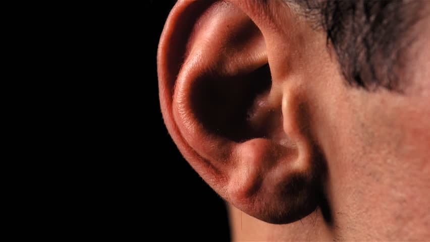 Camera tilt up to male neck and ear