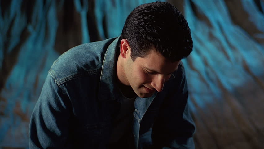 Smiling young man in denim shirt