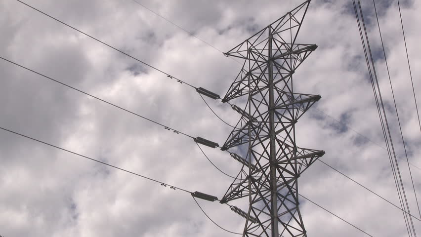 Power line time-lapse with storm clouds moving in.