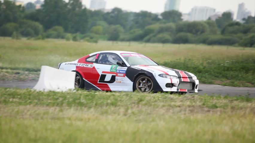 MOSCOW - JUN 11: Car rushes on route near audience and photographers, on 3rd stage of championship on drift Megafon-RDS 2011, on Jun 11, 2011 in Moscow, Russia