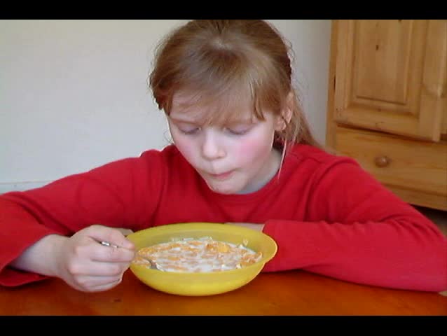 Girl eating cornflakes