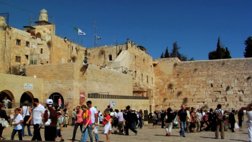 JERUSALEM - CIRCA 2010: Tourists visit the Western Wall Square circa summer 2010 in Jerusalem, Israel.
