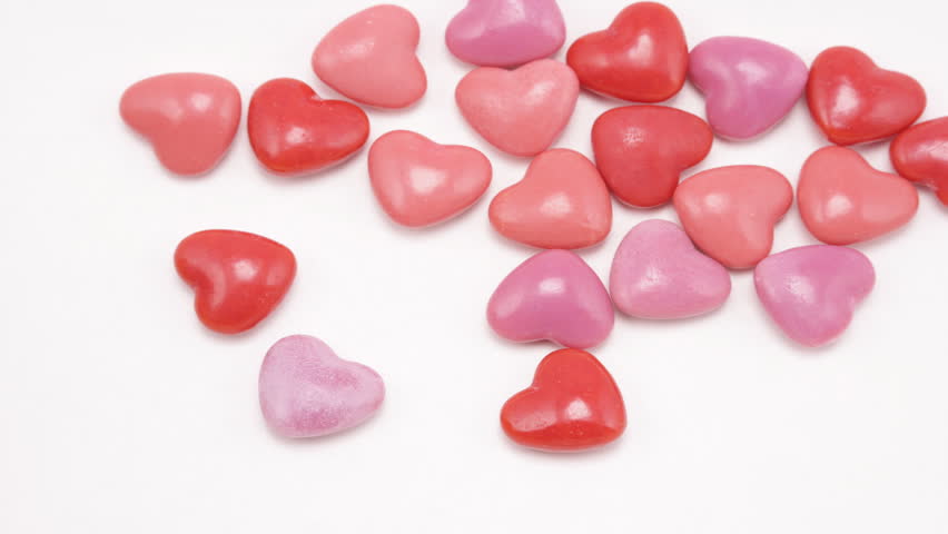 Heart shaped candies gather together, stop motion animation, time lapse, studio.      Format: HD Compression: PhotoJPEG-A Camera: Canon 1ds Mark II Size: 1080 (1920 x 1080) Sound: No