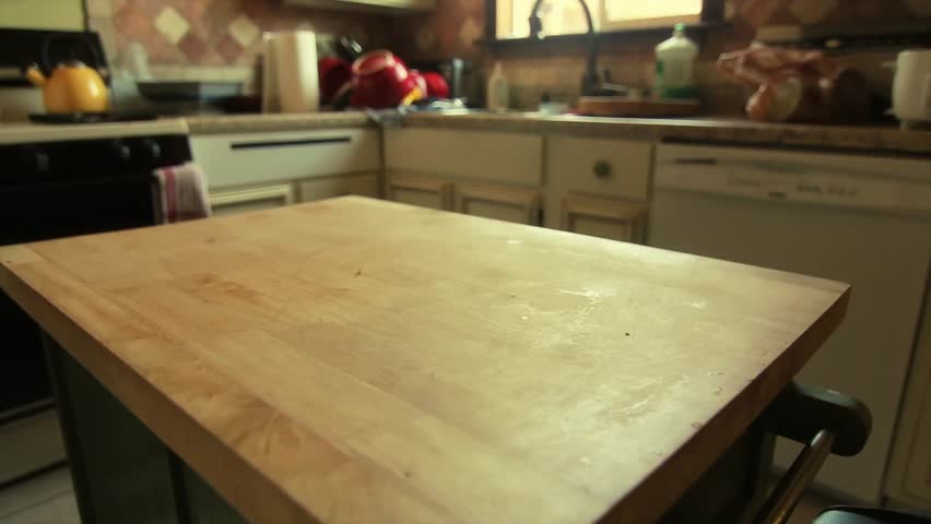 Man Cleans Kitchen