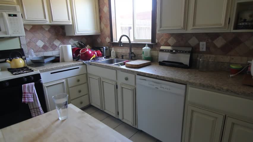 Man Cleans Kitchen
