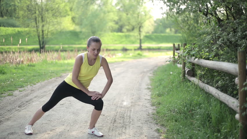 Sportswoman in pain caused by knee injury