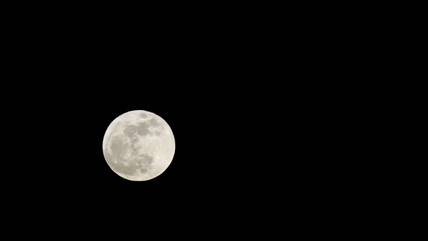 Full Supermoon passes slowly across black night sky. Historic large moon in May 2012. Detail of landscape, craters and plains. Solar system. Middle screen slower timelapse. Fast time lapse.