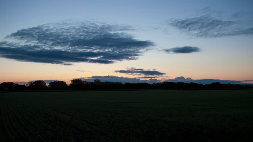 Spring sunrise time-lapse over a English farmers fields.