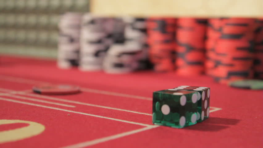 Dice being hooked off the crap table