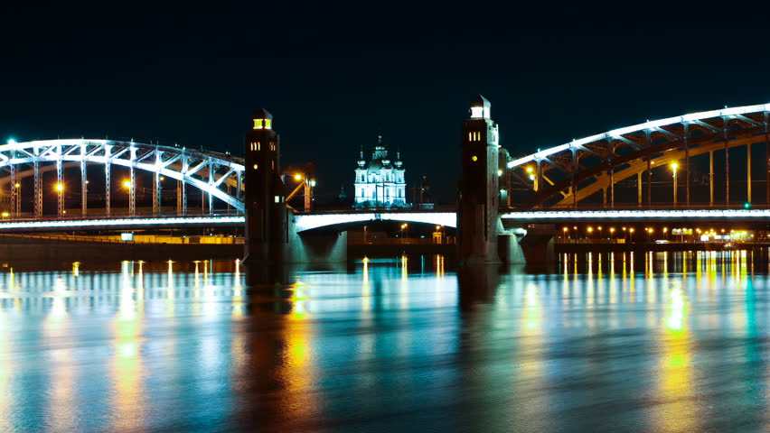 Night movement of machines around the city. Peter the Great Bridge. (Europe, Russia, St. Petersburg) Sliding time-lapse.