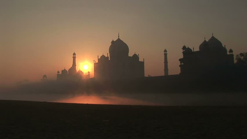 sunrise Mosque and Taj Mahal Minaret, with sun rising behind
