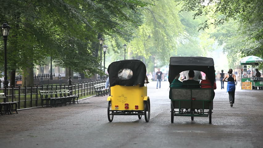 New York - Circa 2009: Central Park in 2009. Rickshaws and joggers in Central Park, New York City, New York.