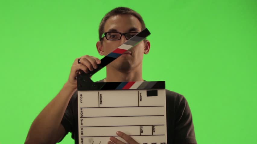 Person holding a clapper board green screen