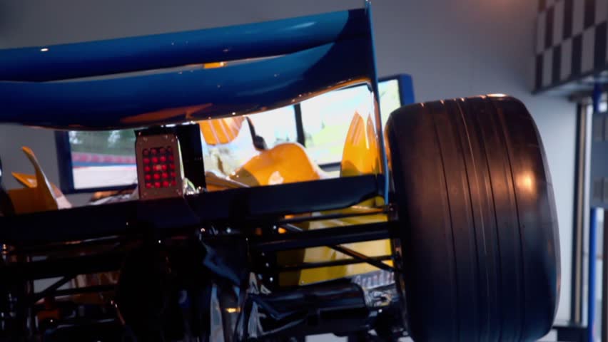 Video game apparatus with sport car model which moves