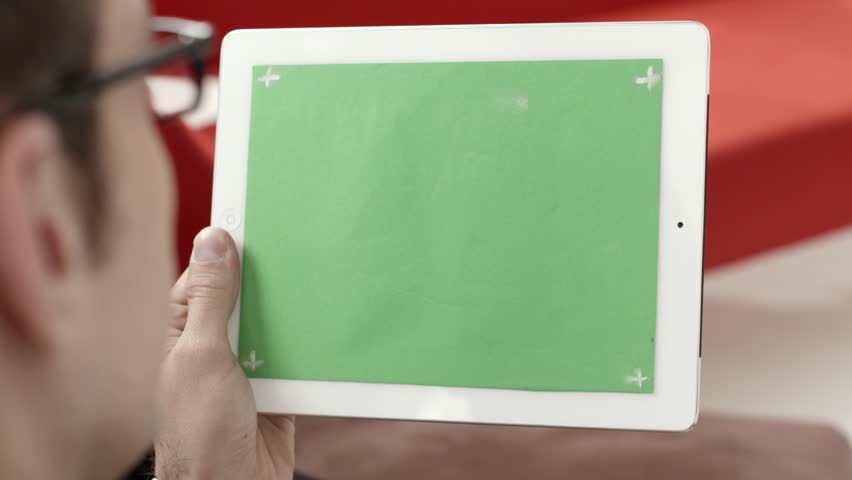 Businessman using digital tablet pc with green screen for internet and email