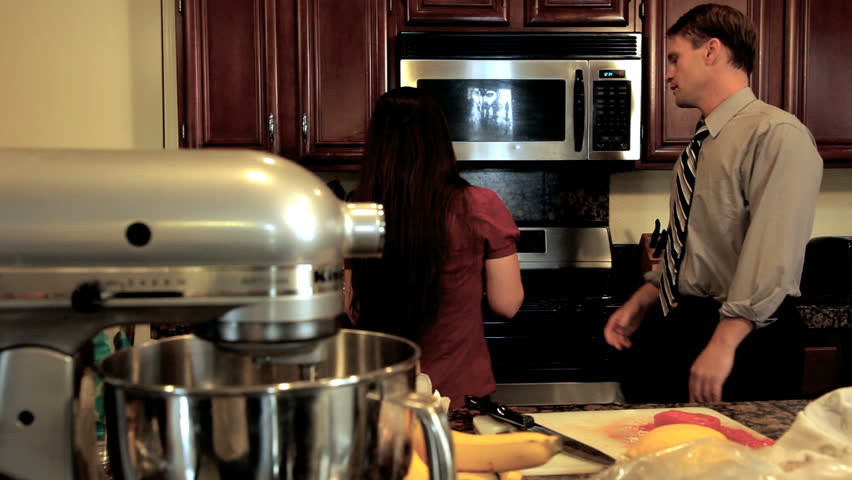 married couple dancing in the kitchen
