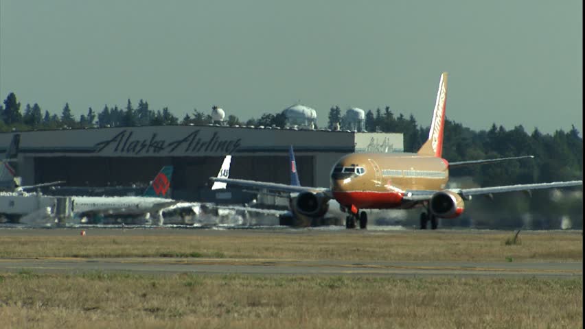 SEATTLE, WA - CIRCA 2001: 737 takeoff into blue sky.