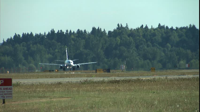 SEATTLE, WA - CIRCA 2001: 737 takeoff Into clear blue Ssky.