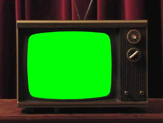 Hand turns TV knob.