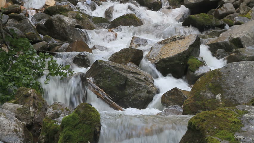 Waterfall and mossy rocks cool and refreshing near Skagway, Alaska.