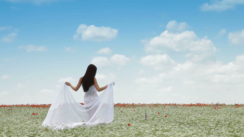 Young Woman With White Scarf In Field