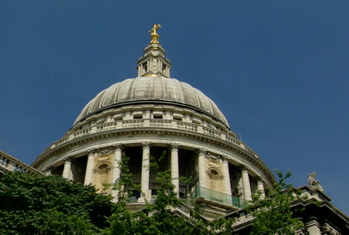 LONDON - Circa 2002: Dome and Facade of St. Paul's Cathedral, the Church of England Cathedral under construction in 2002 with unidentified tourists in front of the cathedral.