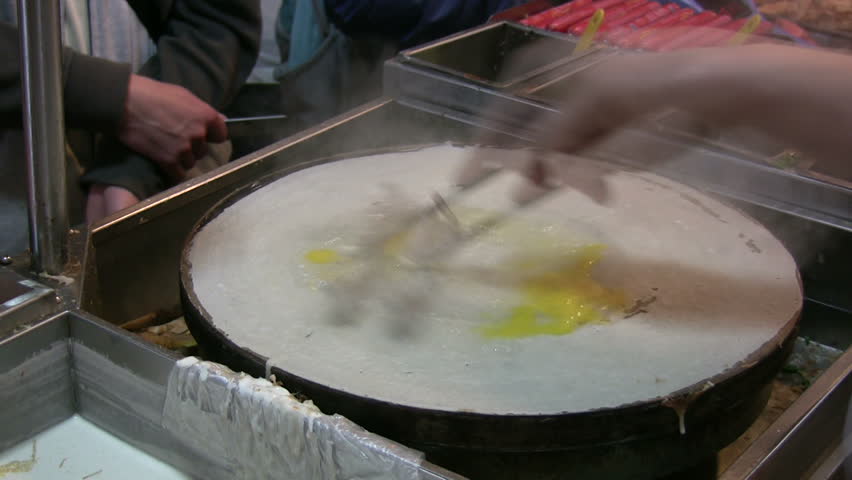 Preparing a Chinese pancake in a school canteen time lapse