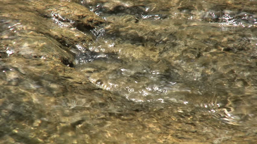 A tiny eddy forms in a creek bed in the jungles of western Thailandl