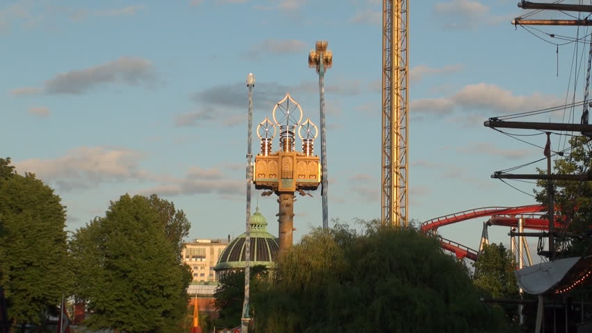 COPENHAGEN, DENMARK - JUNE 20: A ride at Tivoli Park in Copenhagen, Denmark on June 20, 212. It is a major tourist attraction with the world's oldest roller coaster and a variety of entertainment.
