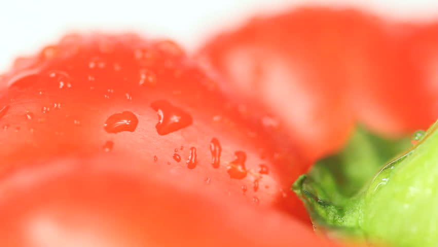 Red Pepper Background - Loopable closeup shot of a big Red bell pepper top rotating slowly on white background, red paprika is sprinkled with water drops making a nice sparkle as they come into focus.