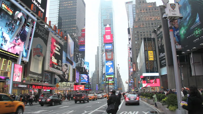 New York, New York, USA - April 14th : Cars and NYC yellow taxis driving across the Times Square shown on 04/14/2011 in New York. 