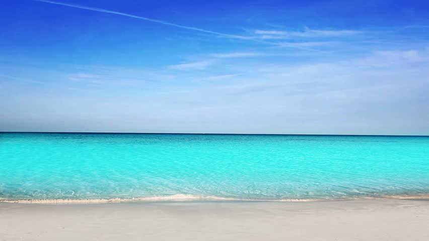Balearic Ibiza Formentera turquoise beach with white sand and blue summer sky