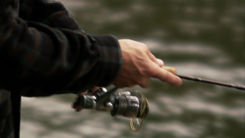 A man fly-fishing in a river
