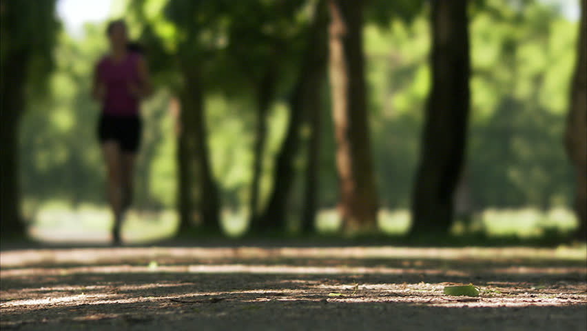 Woman running in a park