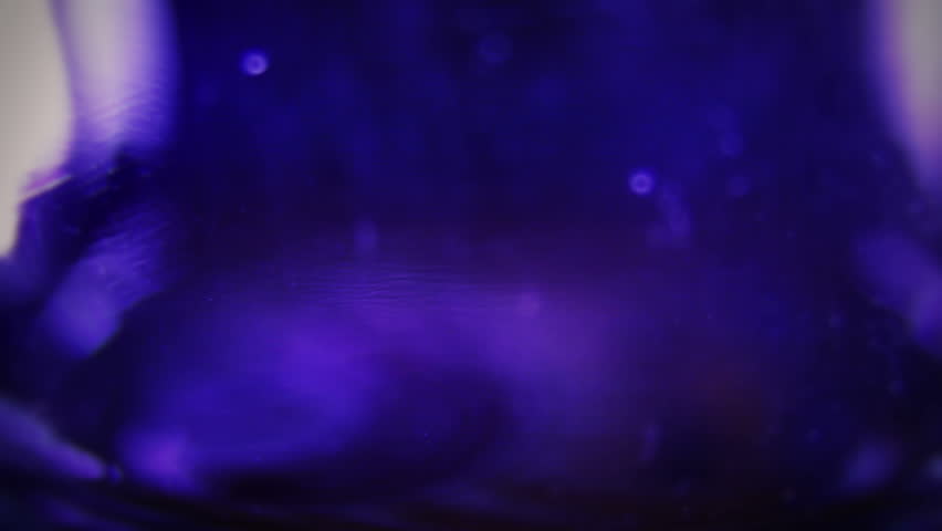 Macro clip of liquid, bubbles and froth. Abstract video that could be used as effect, transition or background and even as a conceptual video.
